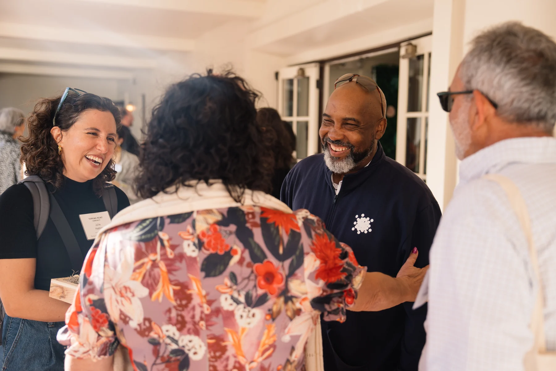 Guests sharing a laugh during a reception at the Executive Summit.